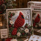 3D fabric poke art kit with framed red bird on snowy evergreen background