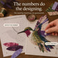 DIY patchwork bird craft kit placement step with fabric bird and numbered guide