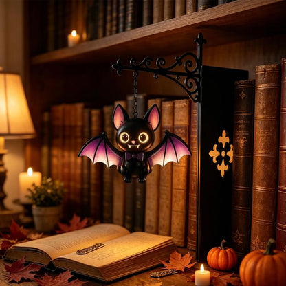 Hanging bat night light figurine with glowing eyes and black wings on chain