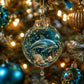Round crystal PET ornament with dolphin inside, gold cap, and hanging chain