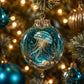 Jellyfish-themed crystal ornament with teal glitter, gold filigree top, and hanging loop
