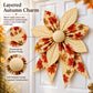 Patchwork quilted bow with orange and cream leaf petals and textured padded center