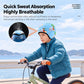 Blue kids cycling cap being worn while riding a bicycle in cold weather