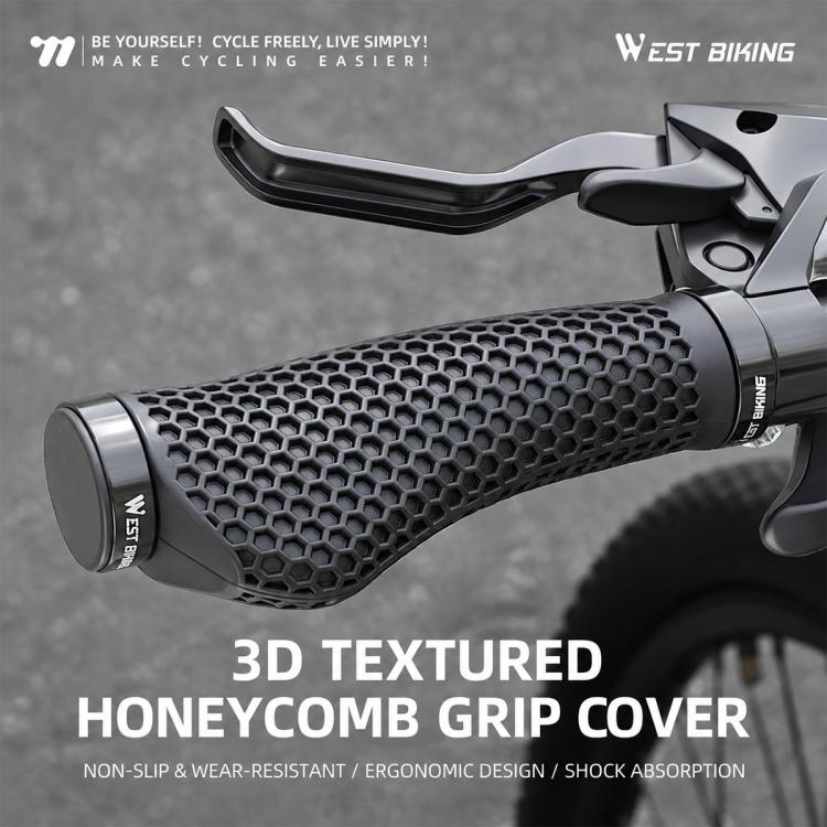 Black honeycomb 3D textured MTB handlebar grips mounted on a bicycle handlebar