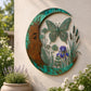 Acrylic circular wall decoration with a teal dragonfly, purple blossoms, and tall grass shapes