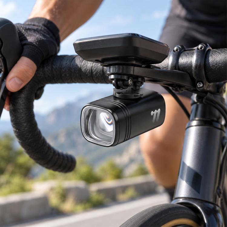 Black bike headlight with front mount bracket and clear LED lens on handlebar