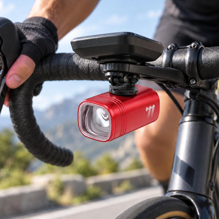 Red bike headlight with front mount bracket and clear LED lens on handlebar