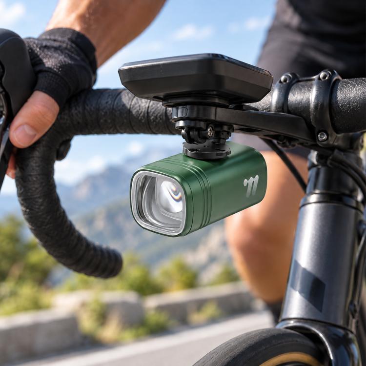 Green bike headlight with front mount bracket and clear LED lens on handlebar
