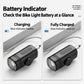 Black rechargeable bike headlight with blue battery indicator and charging setup.