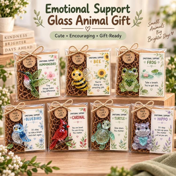 Set of emotional support glass animal gifts in individual clear boxes on a wooden stand