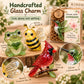 Handcrafted glass charm set featuring hummingbird, bee, frog, and cardinal in display boxes
