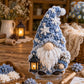 3D fabric poke art gnome with blue textured hat and white beard with lantern