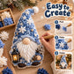 3D fabric poke gnome in blue with white beard and lantern, shown with tools