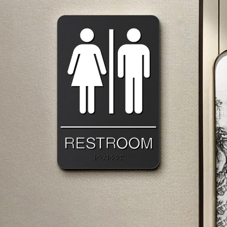 Black restroom Braille sign with restroom icon, raised dots, and RESTROOM label.