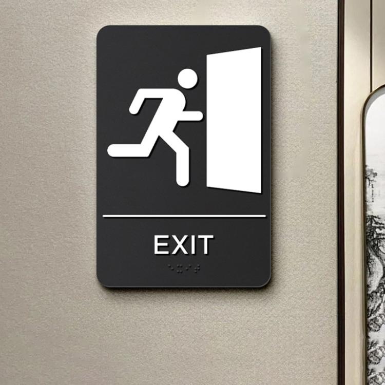 Black Braille sign with raised exit icon, tactile dots, and EXIT label.