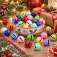 Multi-color painted round bell charms with small top loops in a decorative bowl
