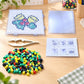 Christmas fuse bead template set with multicolor motif board, beads, and guide card