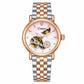 Women’s steel bracelet watch with rose gold strap accents and pink open-work moon dial