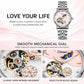 Women’s steel bracelet watch with silver strap and open-work dial with moon stars