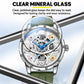 Automatic skeleton watch with silver case and green silicone strap with transparent dial