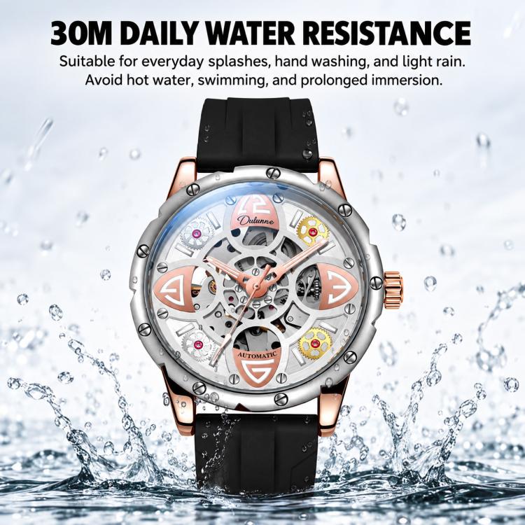 Automatic skeleton mechanical watch with black silicone strap shown with water splash