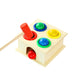 Wooden percussion toy with green, blue, yellow buttons and red mallet