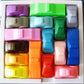 IQ car puzzle tray with multi-colored plastic blocks and molded slots