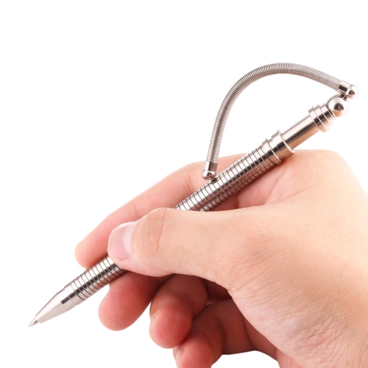 Metal magnetic fidget pen with coiled spring, shown in use in hand