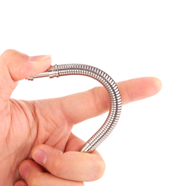 Metal magnetic fidget pen spring loop held between fingers