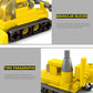 Yellow block vehicle with circular wheel details, black underside panels, and cannon barrel