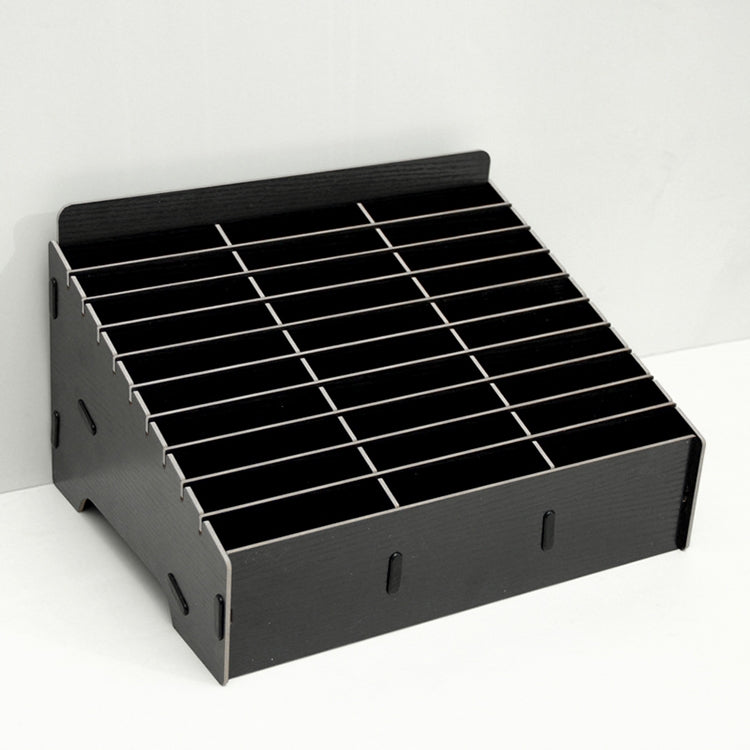 Black multi-cell phone film stand with empty grid dividers.