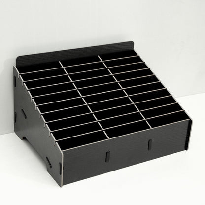 Black multi-cell phone film stand with empty grid dividers.