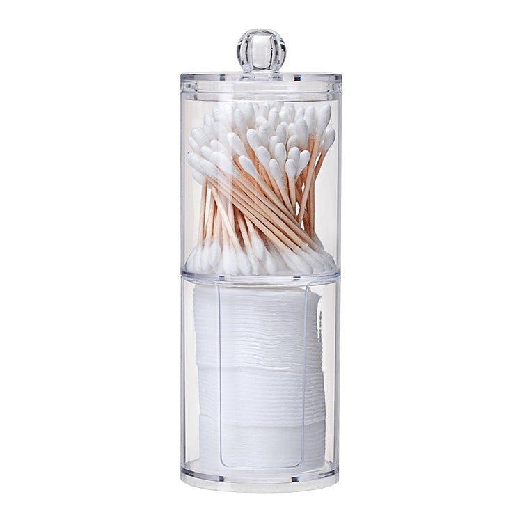 Clear round plastic cosmetic storage box with cotton swabs on top and cotton pads below.