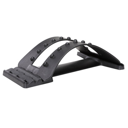 Black lumbar traction stretching device with arched frame and raised massage nodes