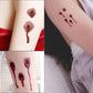 Realistic bullet wound blood temporary tattoos applied on forearm with drips