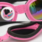 Pink dog sunglasses close-up, black strap and rainbow mirrored lenses on curved frame