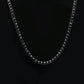 Black single-row rhinestone chain necklace with curved tennis-style stones