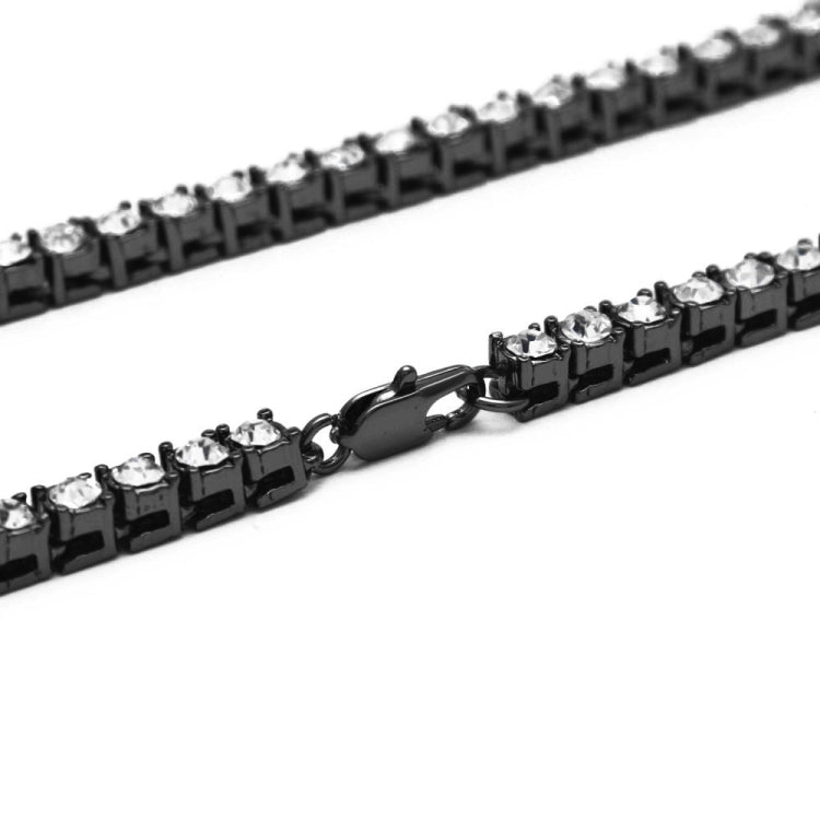 Close-up of black and clear rhinestone chain links with metal clasp hook