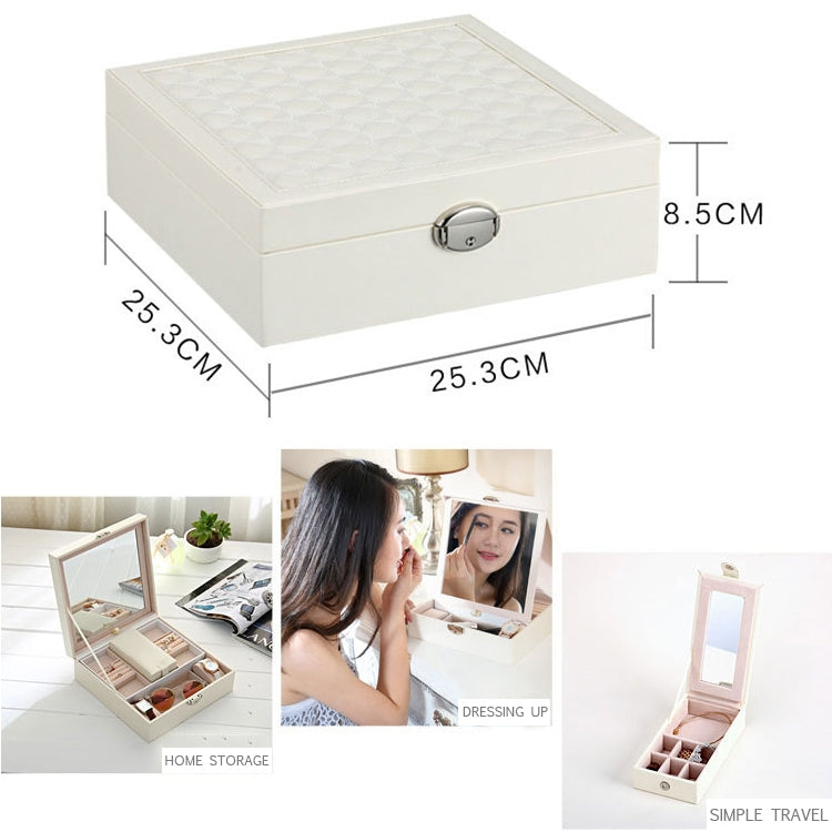 White wooden jewelry box with quilted top, oval silver latch, rectangular profile