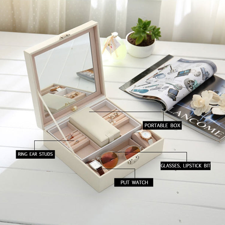 Open white jewelry organizer with mirror and compartment trays for bracelets and rings