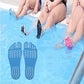 Blue anti-slip summer sandal insoles on feet in shallow water