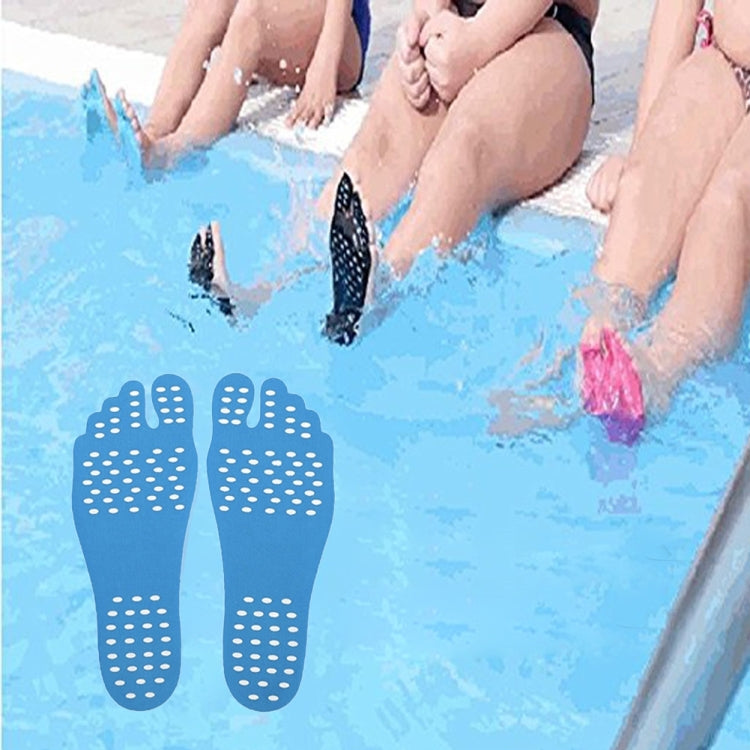 Blue anti-slip summer sandal insoles on feet in shallow water