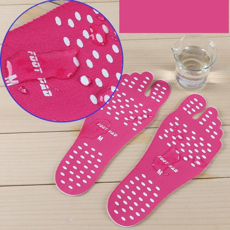 Pink dotted anti-slip sandal insoles on tabletop, with size markings