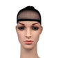 Black mesh wig liner cap on mannequin head, front view