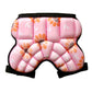 Pink padded hip protector shorts with black waistband and straps, patterned foam pads