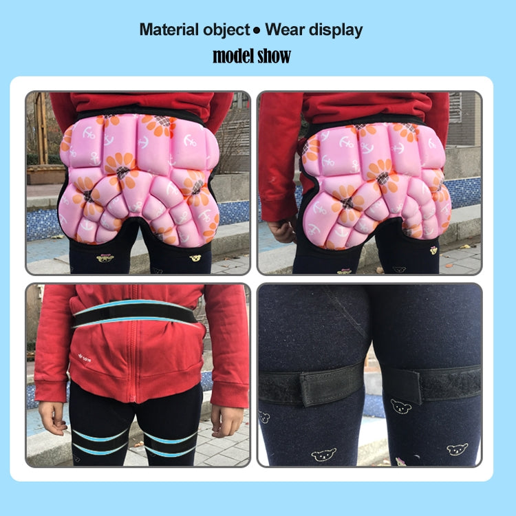 Pink kids hip protector shorts with black elastic waistband and foam padding panels