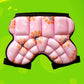 Close-up pink padded hip protector shorts with black waistband and patterned foam blocks