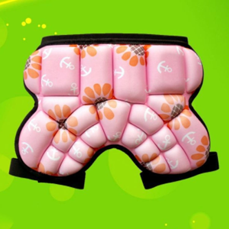 Close-up pink padded hip protector shorts with black waistband and patterned foam blocks
