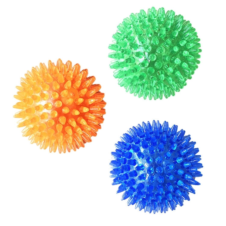 Set of spiky hedgehog dog toy balls in green, orange, and blue