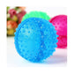 Close-up blue spiked rubber chew ball with small side treat opening